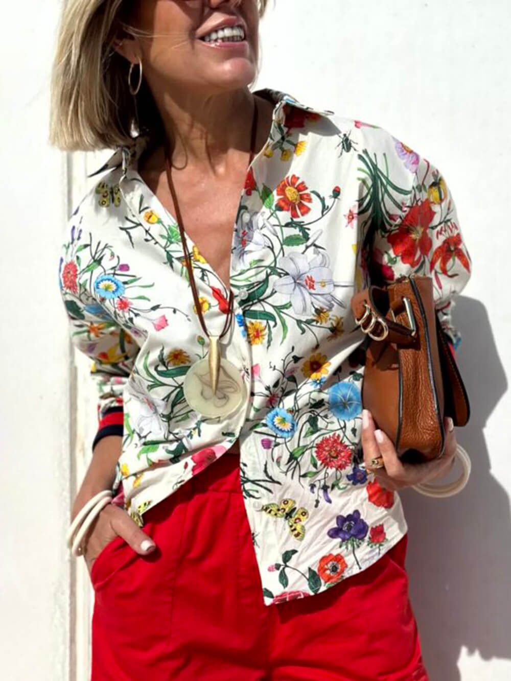 Blusa extragrande con botones y estampado floral único