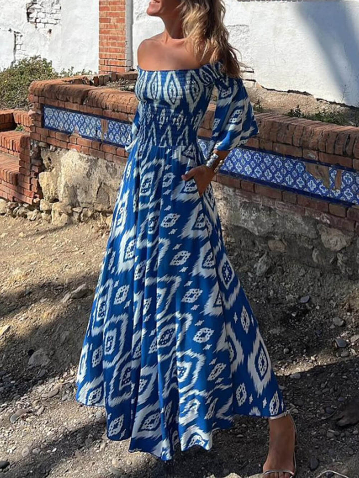 Wakacyjna sukienka maxi z nadrukiem w etnicznym kolorze, z odkrytymi ramionami i kieszeniami