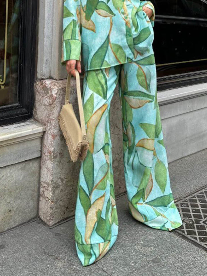 Exquisite, einzigartige Hose mit weitem Bein und elastischen Taschen und Palmblatt-Print
