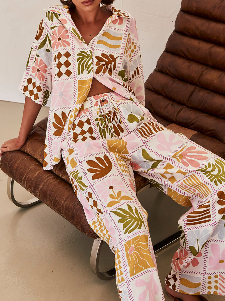Roze unieke print broek met wijde pijpen, elastische taille en zakken