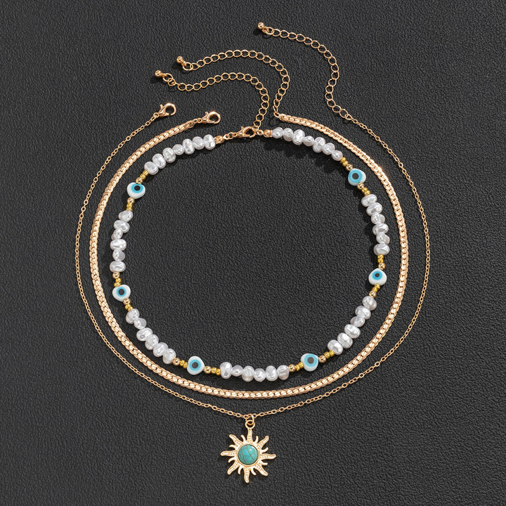 Ethnesch Stil Special-Form Imitation Pearl Bead Halskette Retro Turquoise Sun Eye Halskette