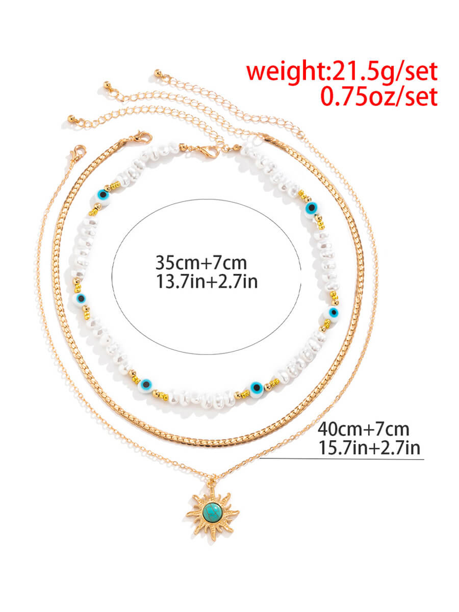 Collana con perle imitazione di perle speciali a forma speciale in stile etnico. Collana retrò con occhi di sole turchese