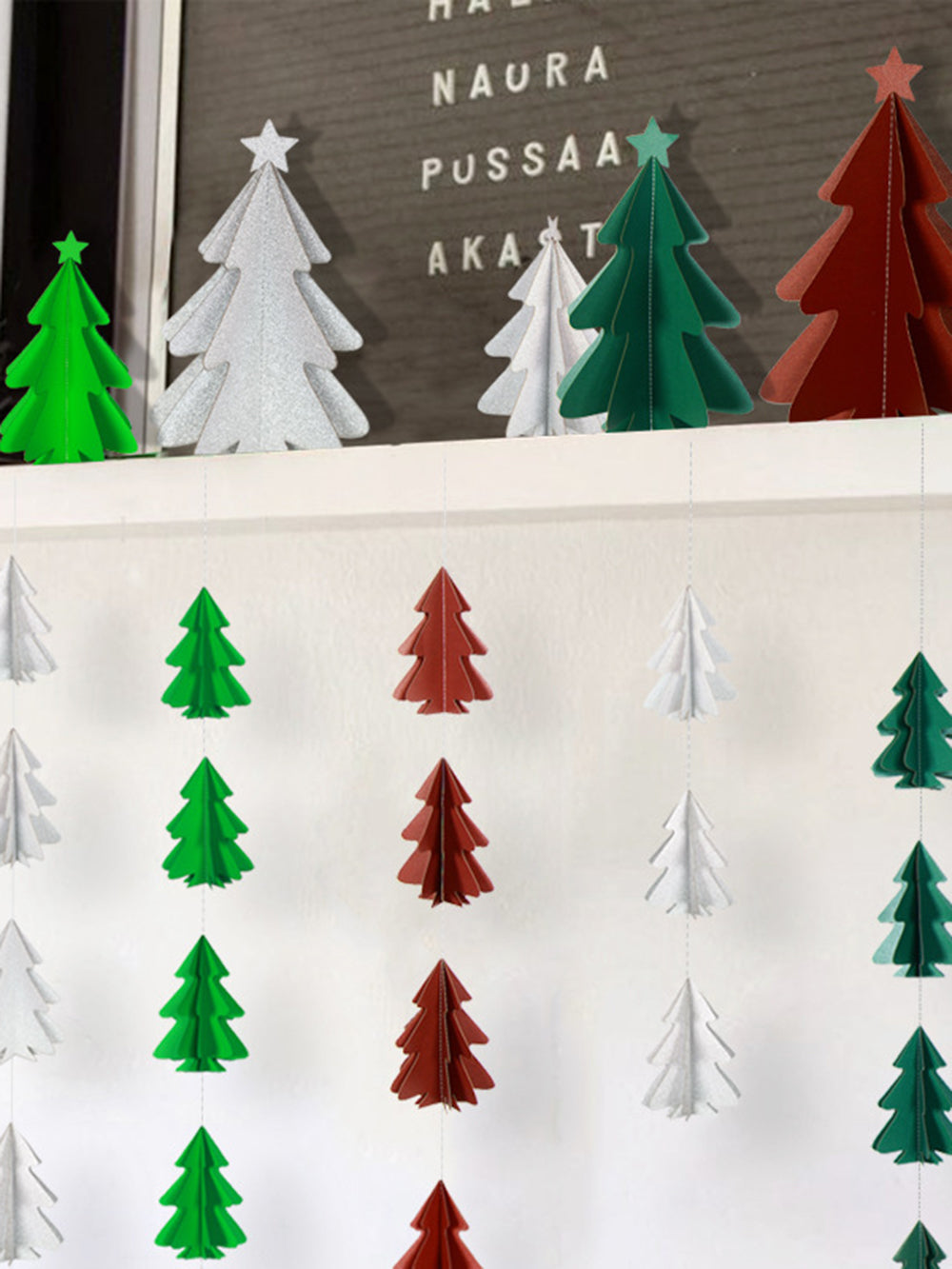 Mini Christmas Tree With Paper String Flowers And Hanging Flags