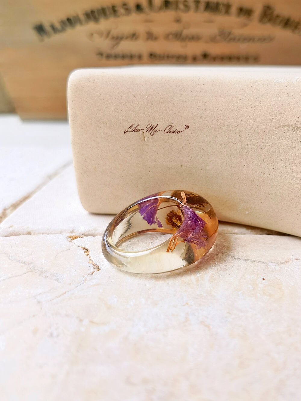 Dried flower resin ring with purple flowers