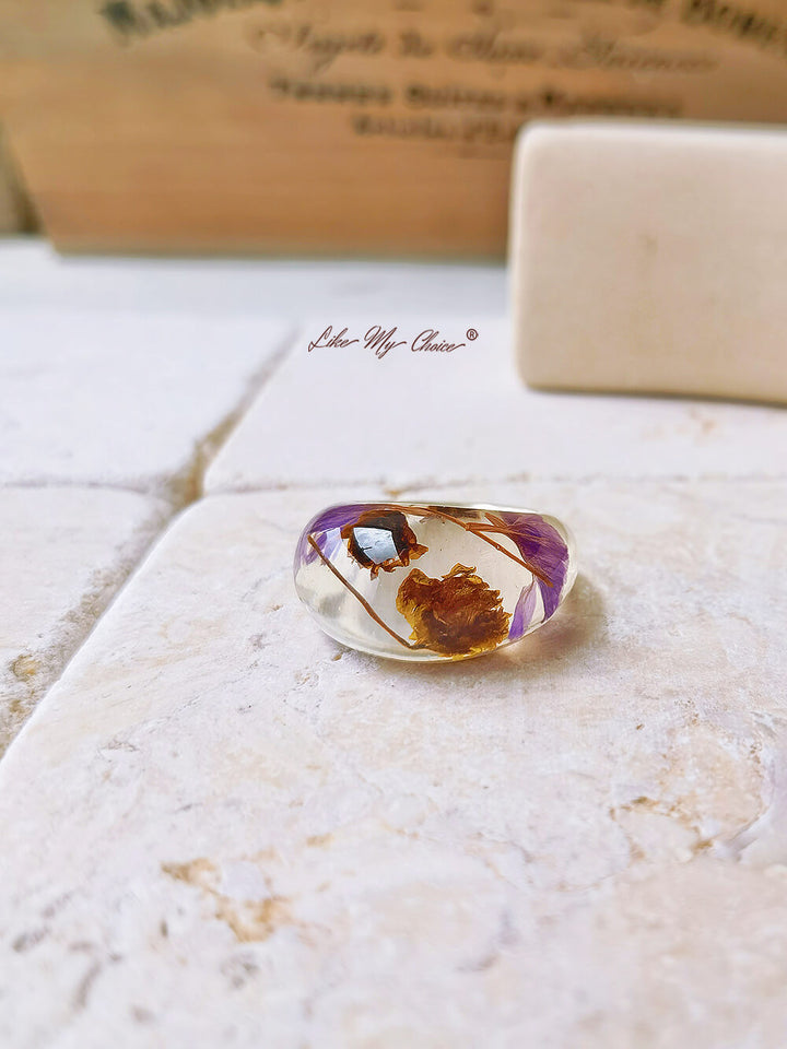 Dried flower resin ring with purple flowers
