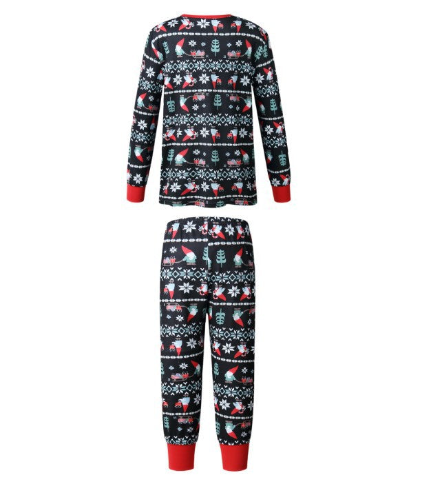 Söt tomte och snöflingatryck familj matchande pyjamasset