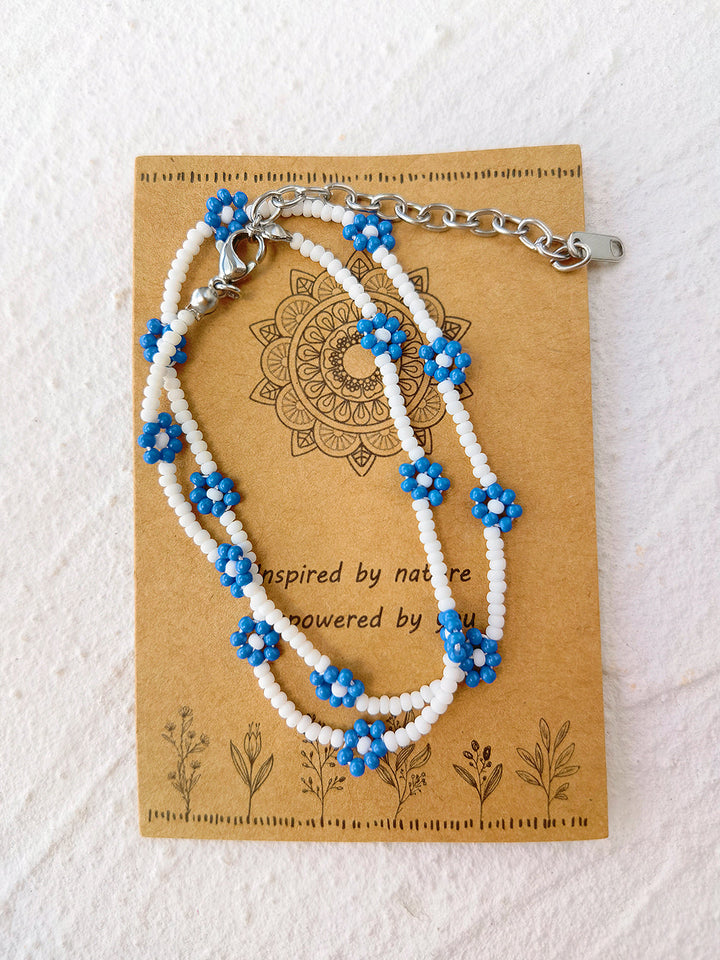 Verstellbares Perlenarmband mit Kordelzug, blaues Gänseblümchen