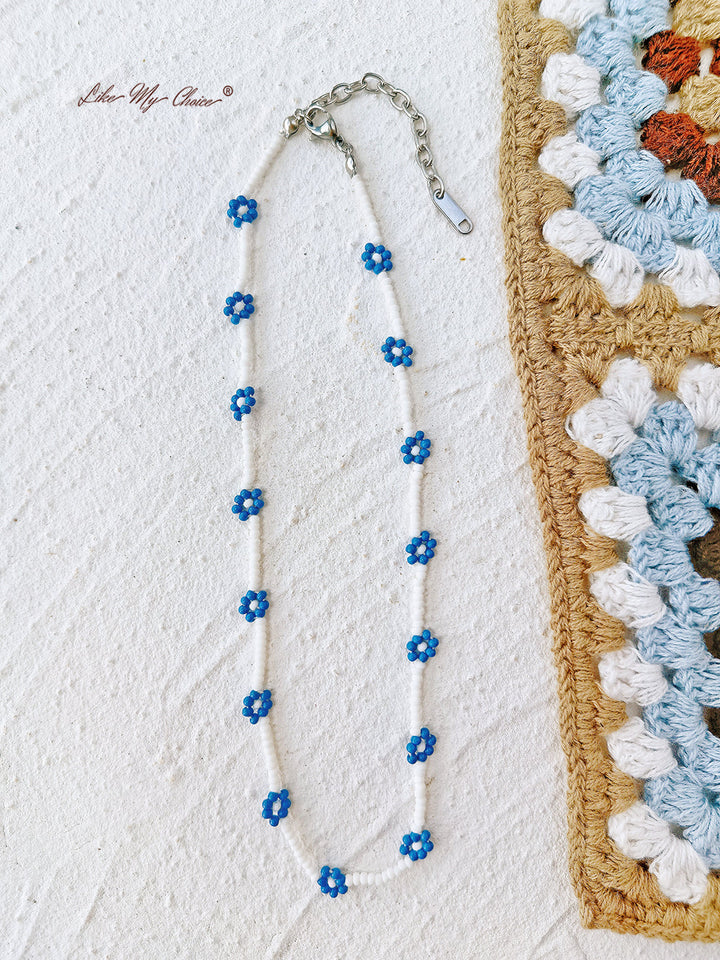 Verstelbare kralenarmband met trekkoord, blauwe madeliefje
