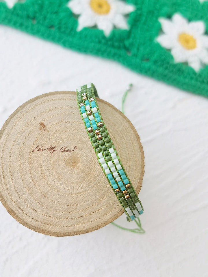 Bracelet Perlé Cordon Ajustable Pompons Vert Dégradé