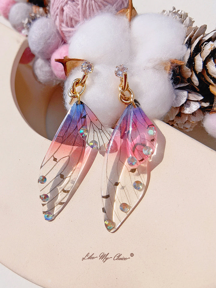 Boucle d'oreille asymétrique aile de papillon, cristal et diamant