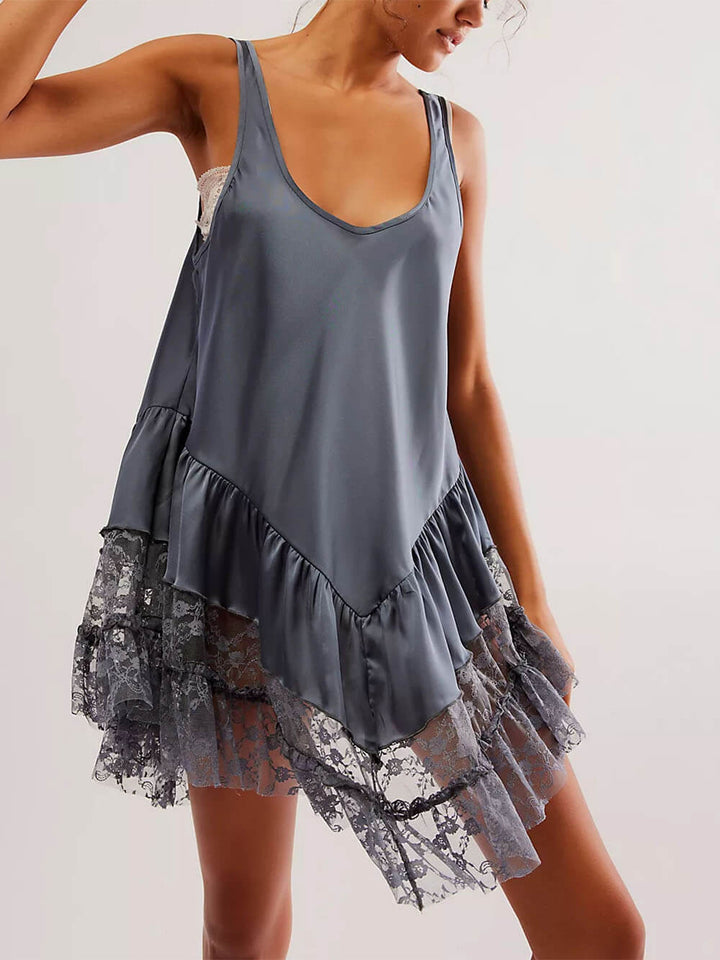Mouwloze mini-jurk met kanten paneel