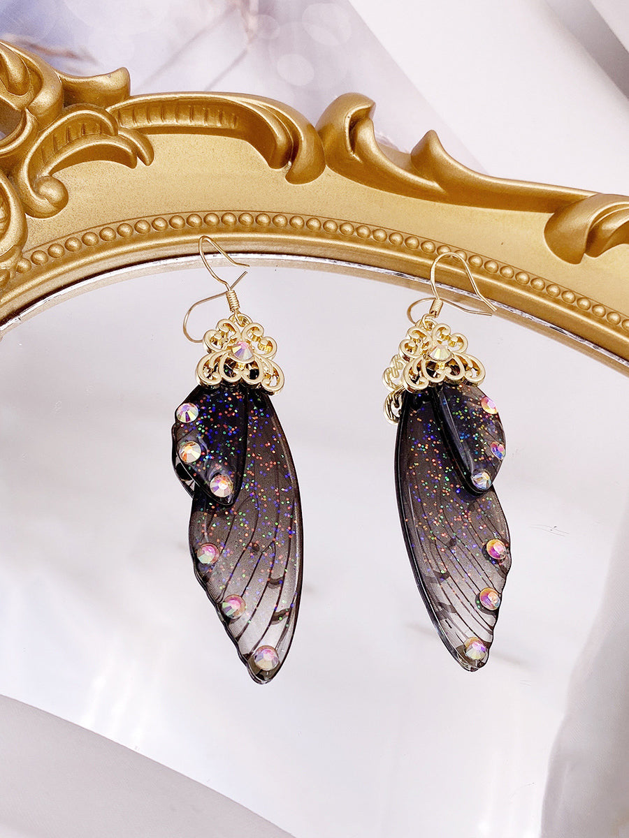 Orecchini in cristallo con ala di cicala con strass neri e ala di farfalla