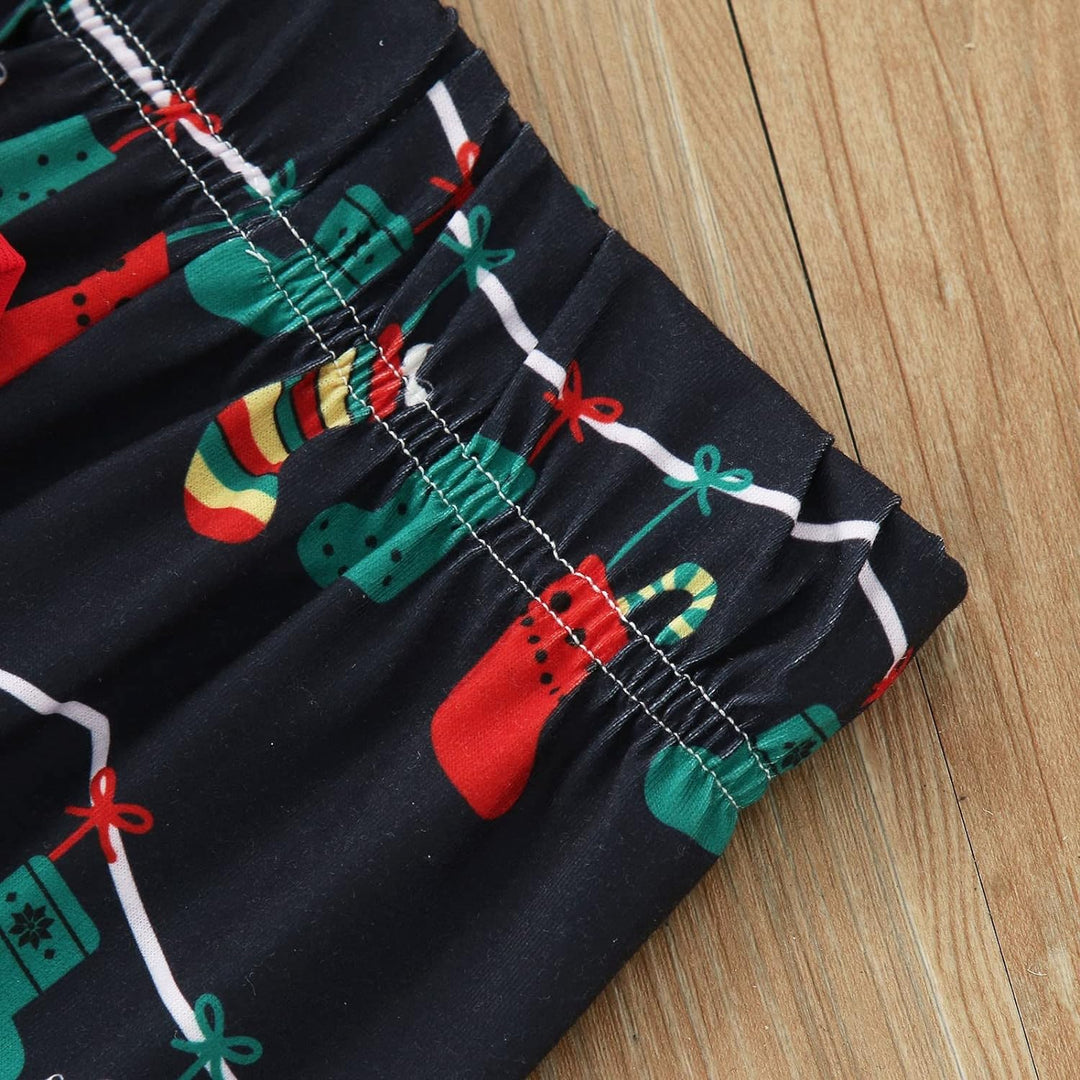 Sort julelyspære familiematchende pyjamassett (med hundeklær til kjæledyr)