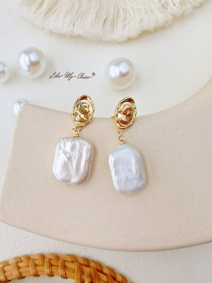 Boucles d'oreilles déesse vintage en perles d'eau douce : simples et chics.