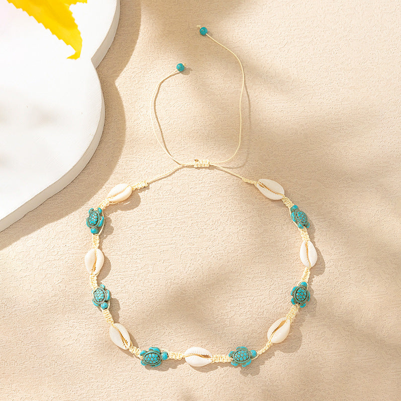 Ensemble collier et bracelet en coquillages inspirés de l'océan pour les vacances