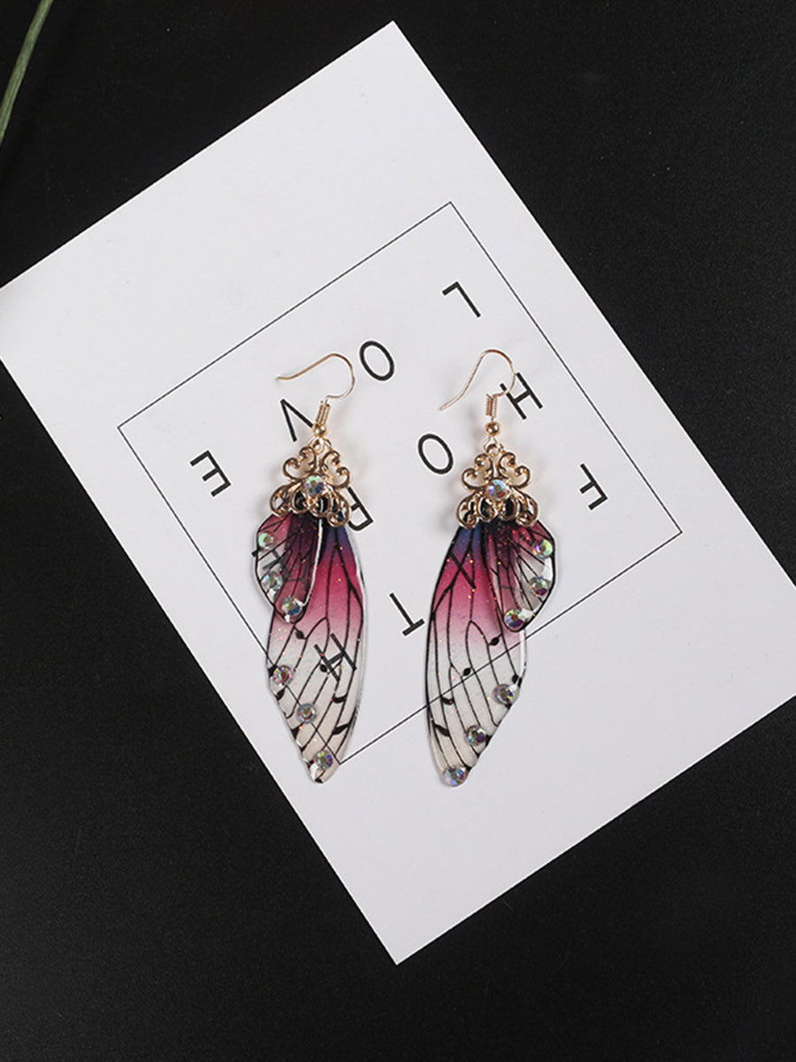 Boucles d'oreilles en cristal d'aile de cigale en strass violet avec aile de papillon